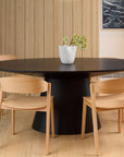 Alice oval dining table in black oak