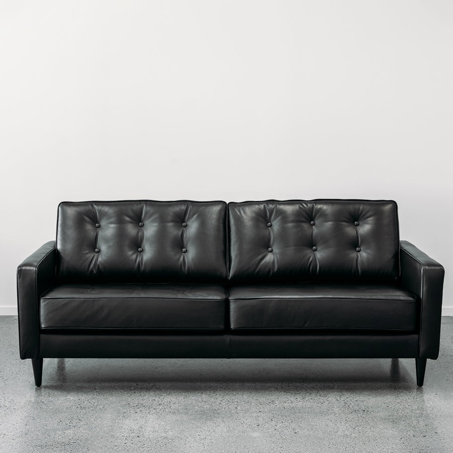 Chanel black leather sofa