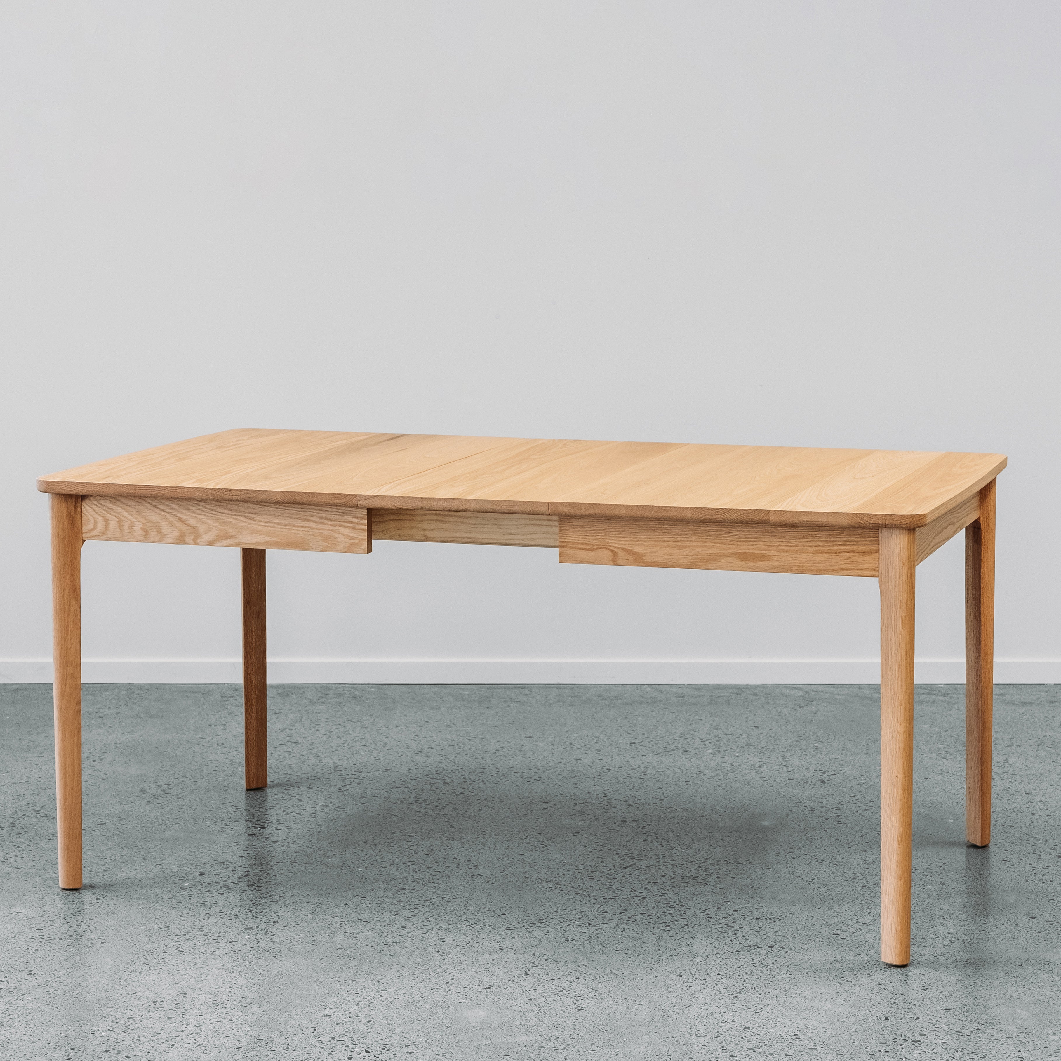 Ghost Dining Extension table in red oiled oak