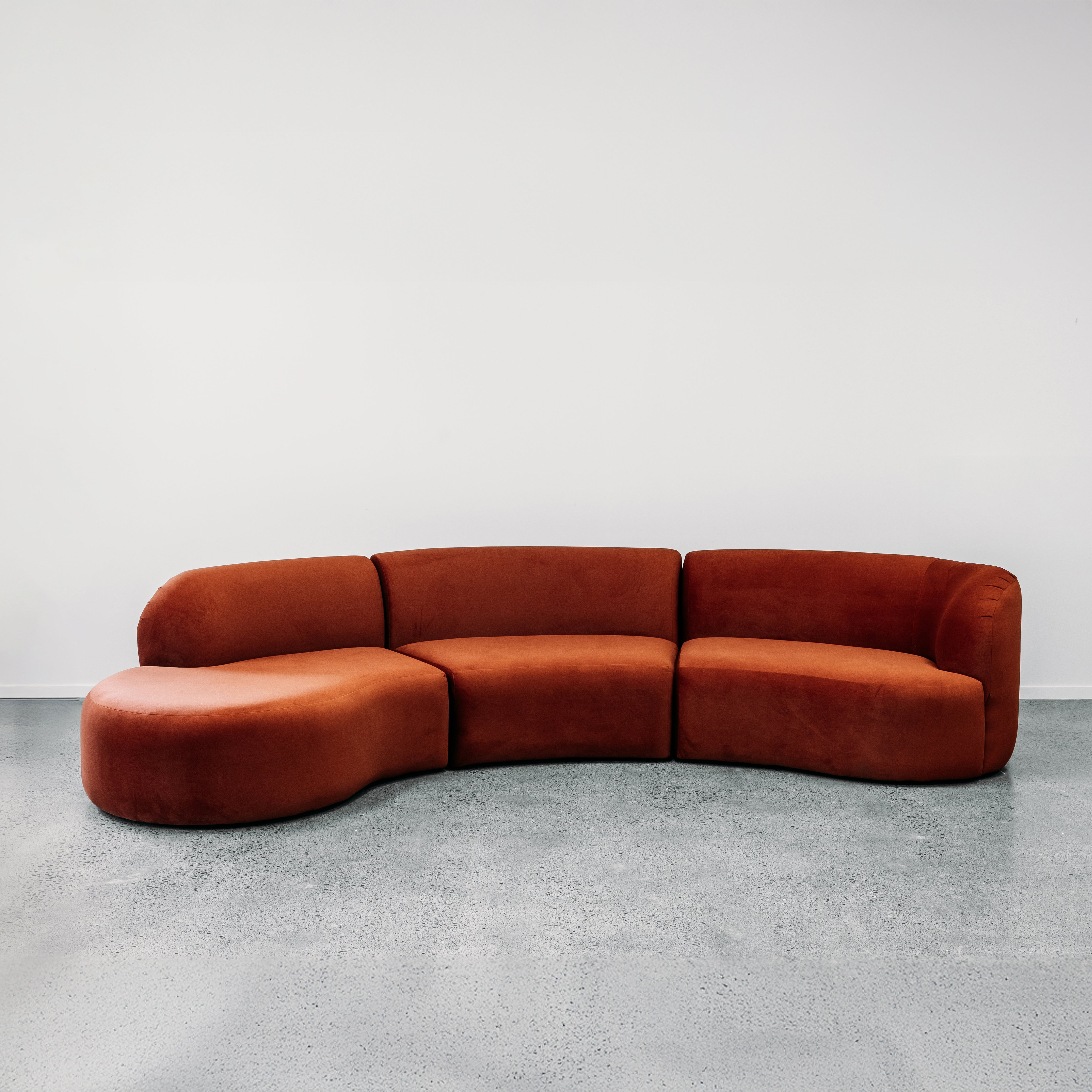 Hendricks Modular curved sofa in ankara terracotta