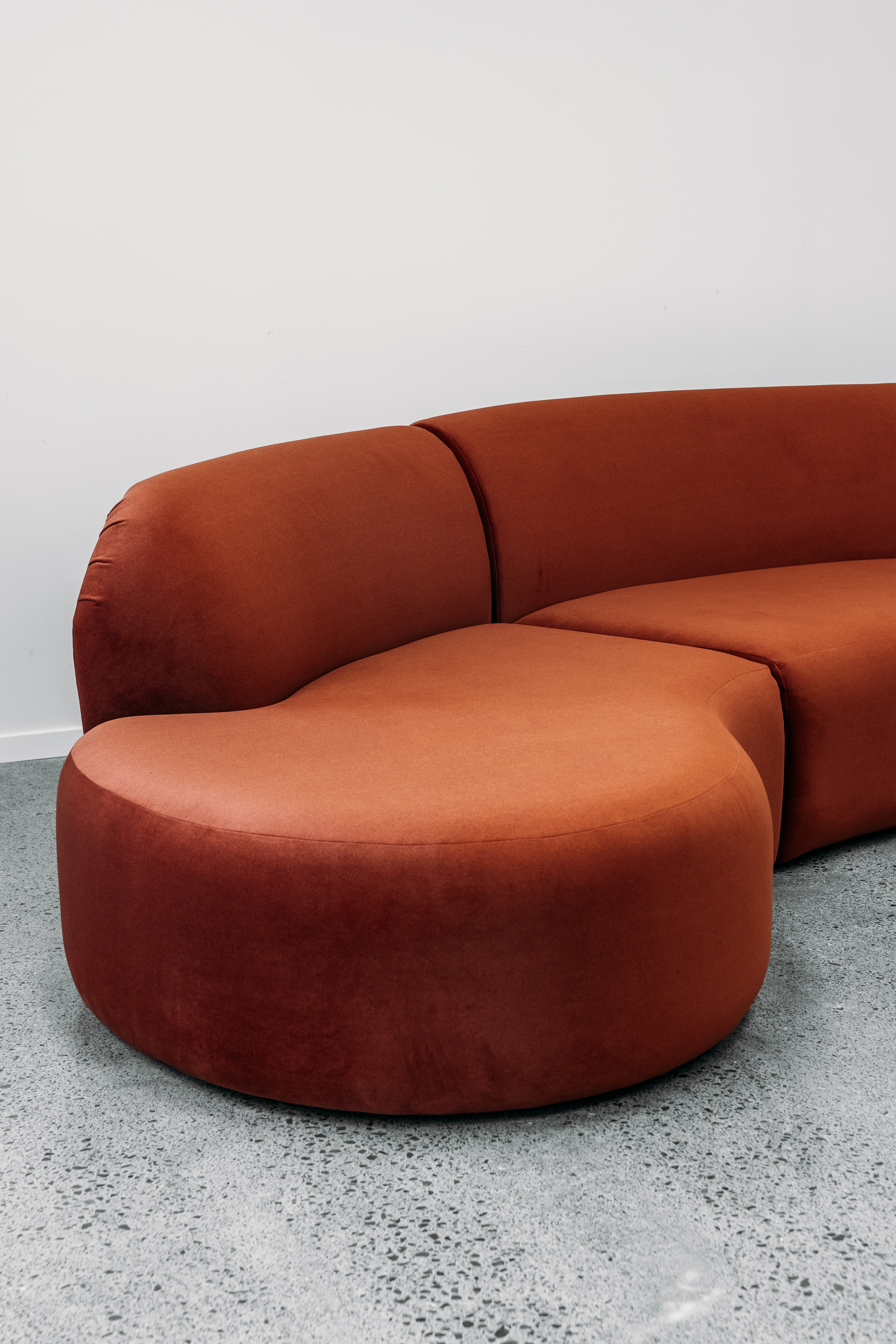 Hendricks Modular curved sofa in ankara terracotta