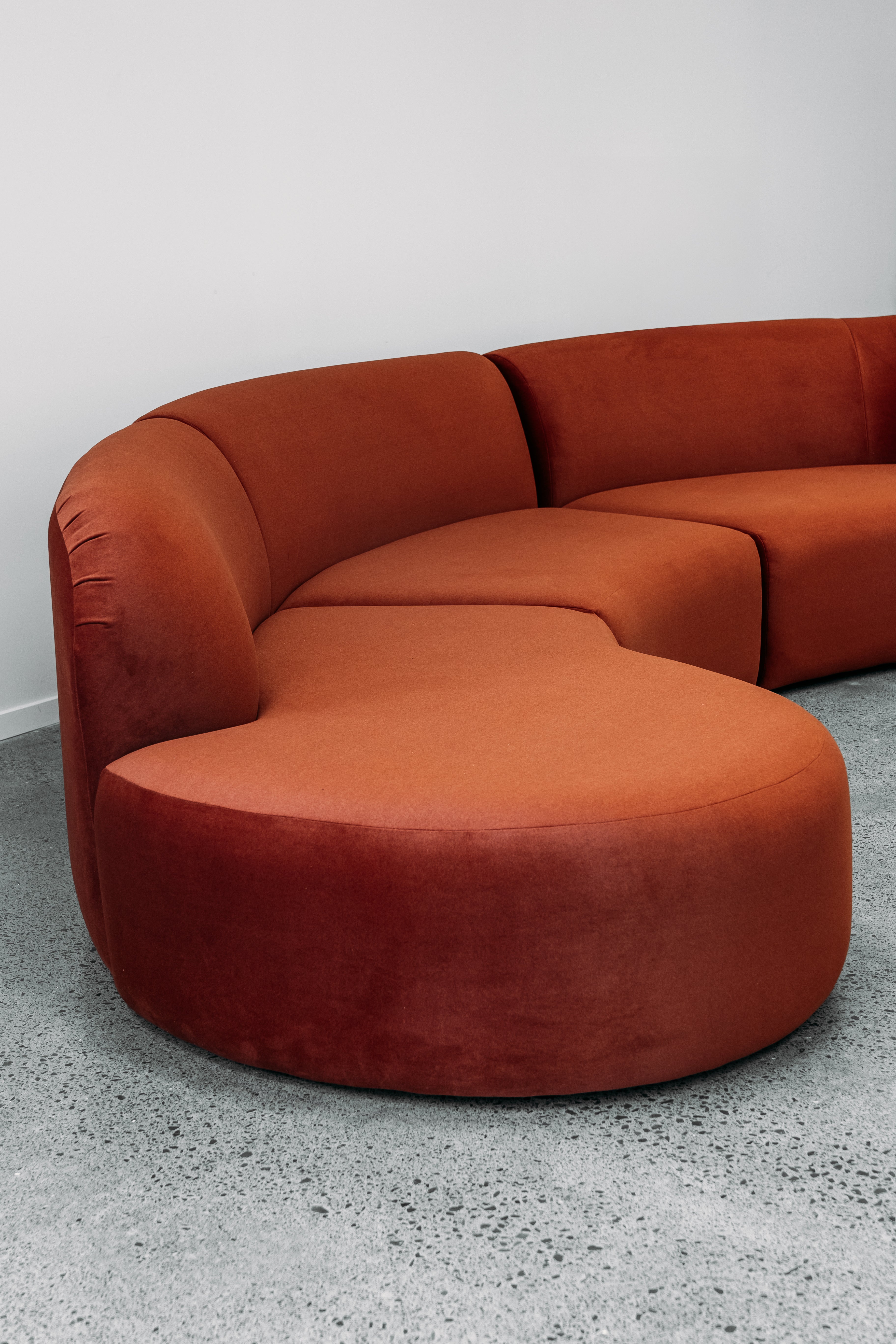 Hendricks Modular curved sofa in ankara terracotta