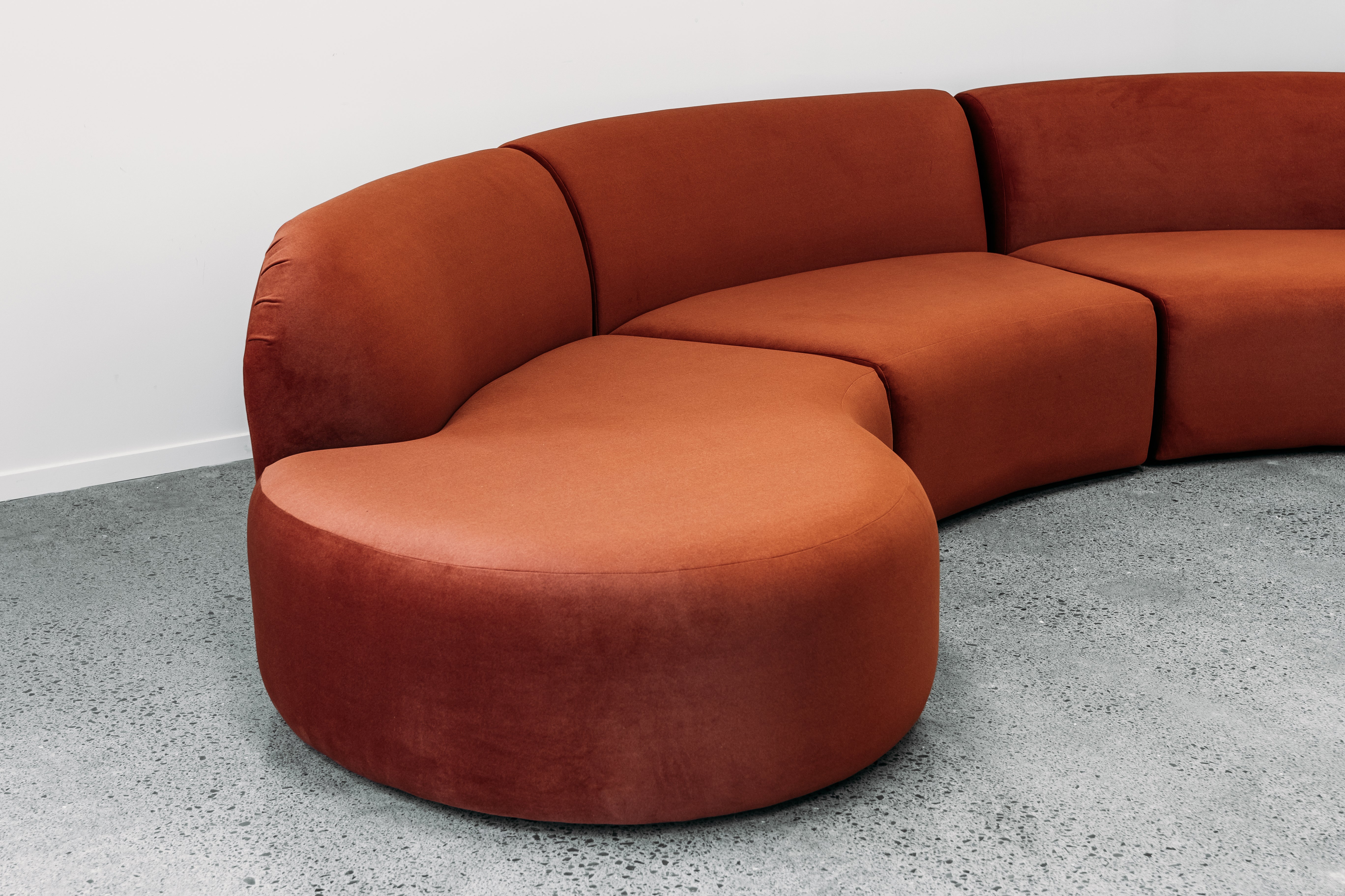 Hendricks Modular curved sofa in ankara terracotta