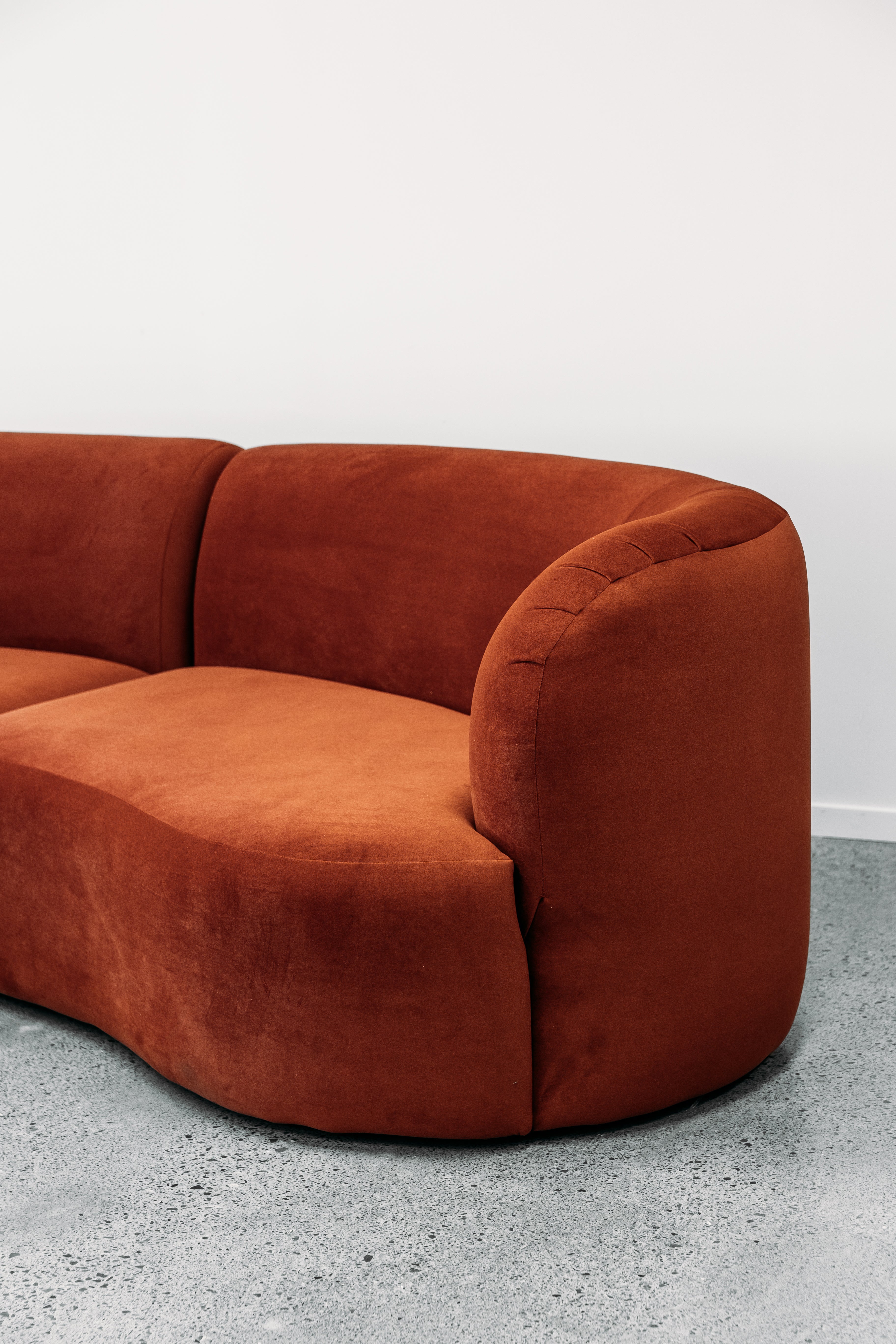 Hendricks Modular curved sofa in ankara terracotta