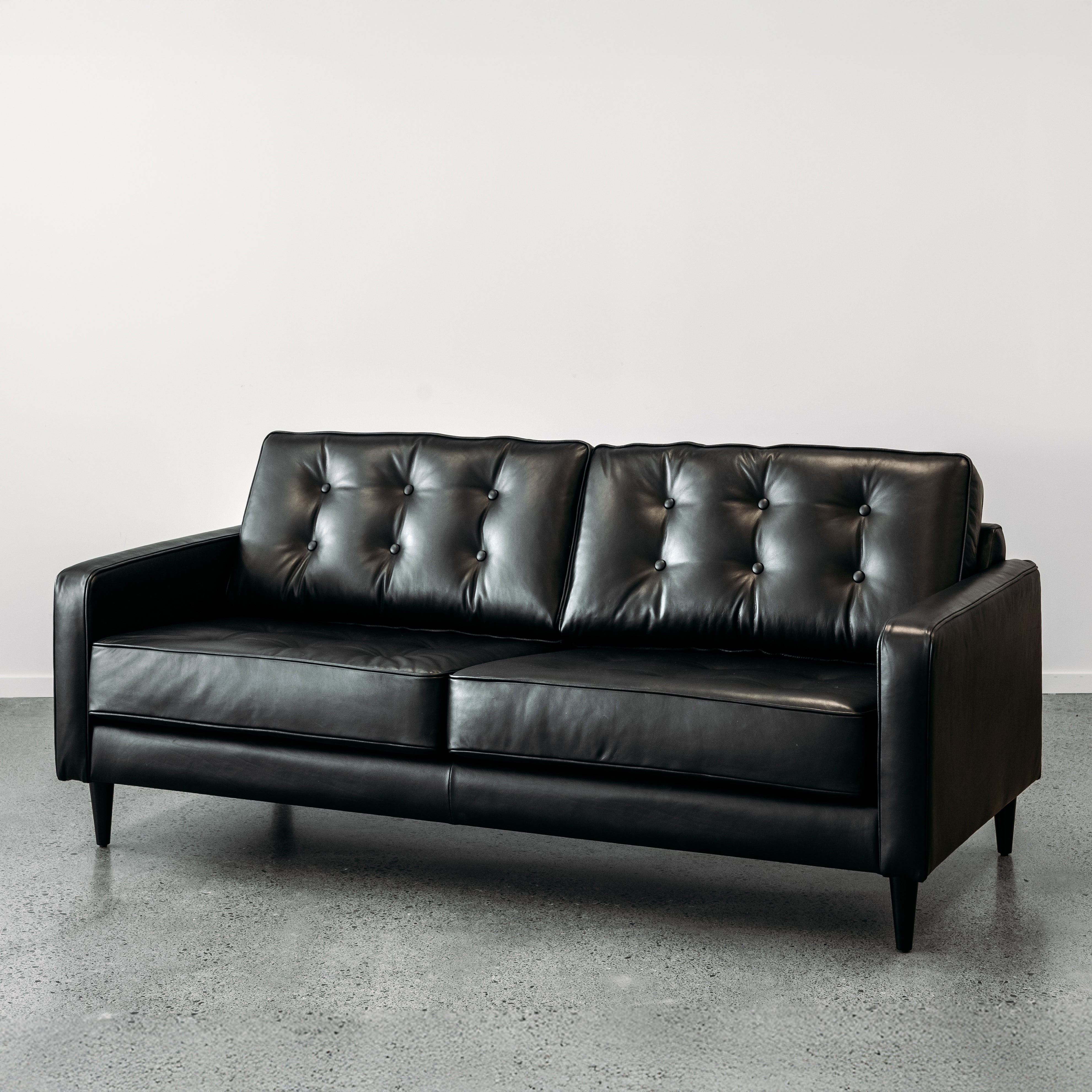 Chanel black leather sofa