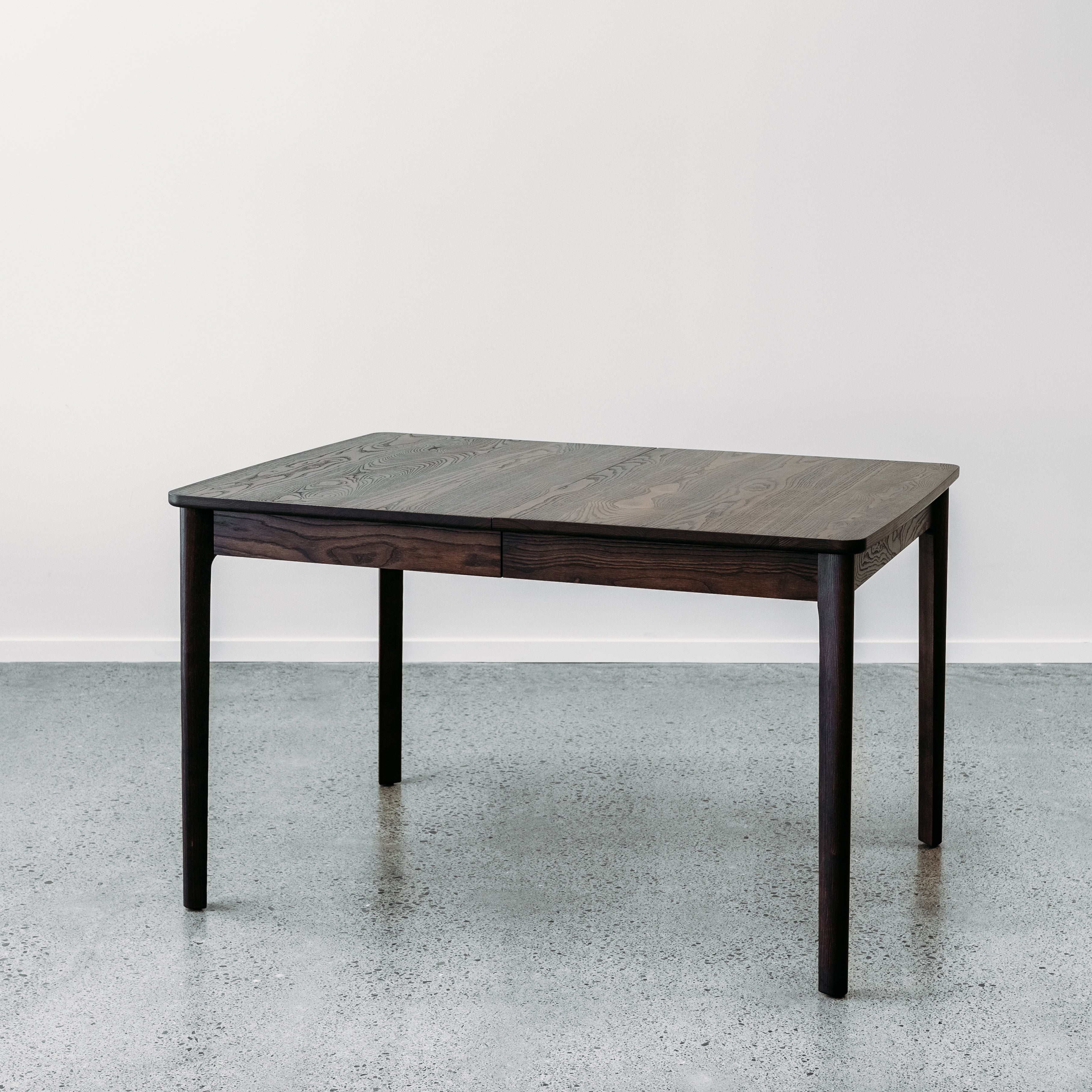 Ghost twin leaf extension table