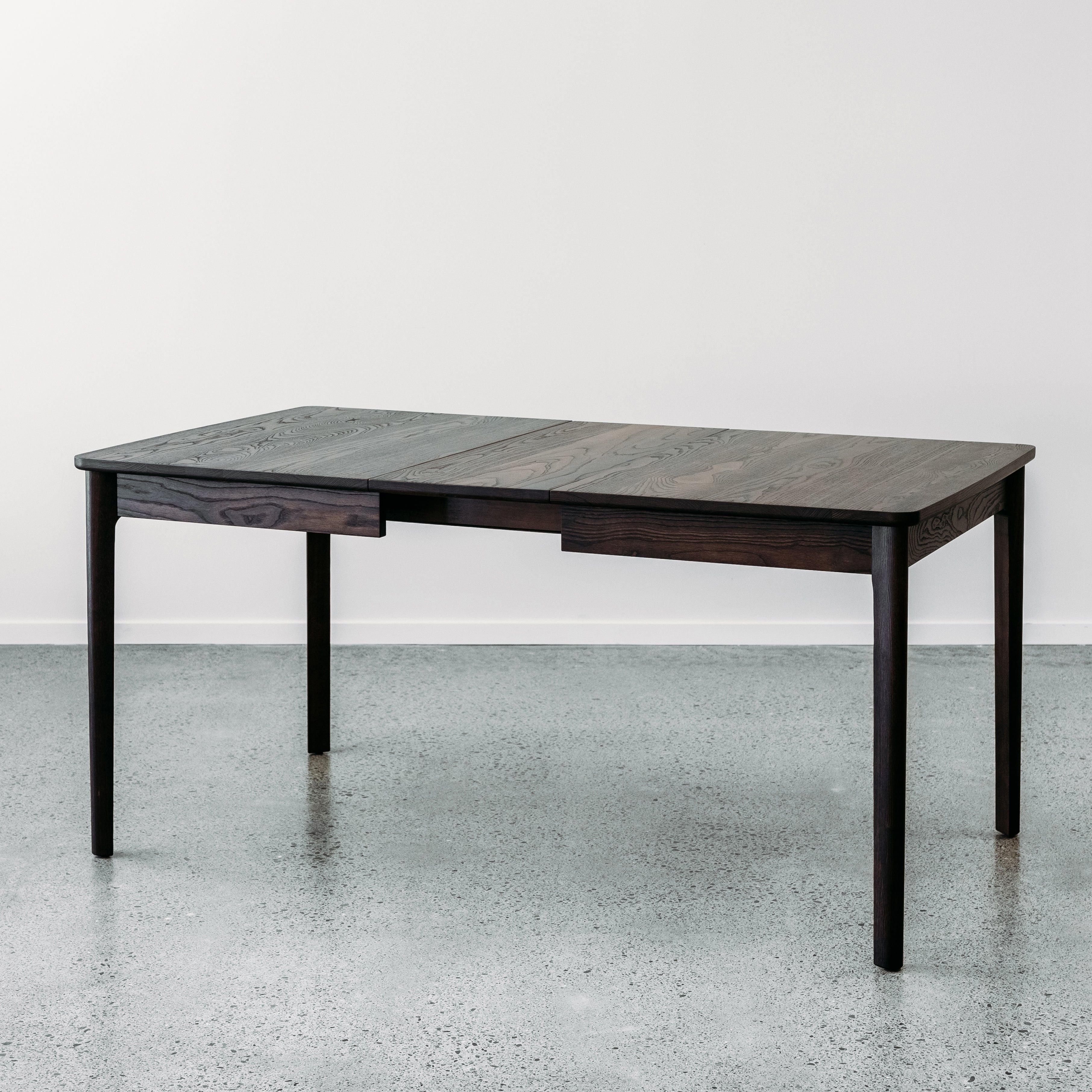 Ghost twin leaf extension table