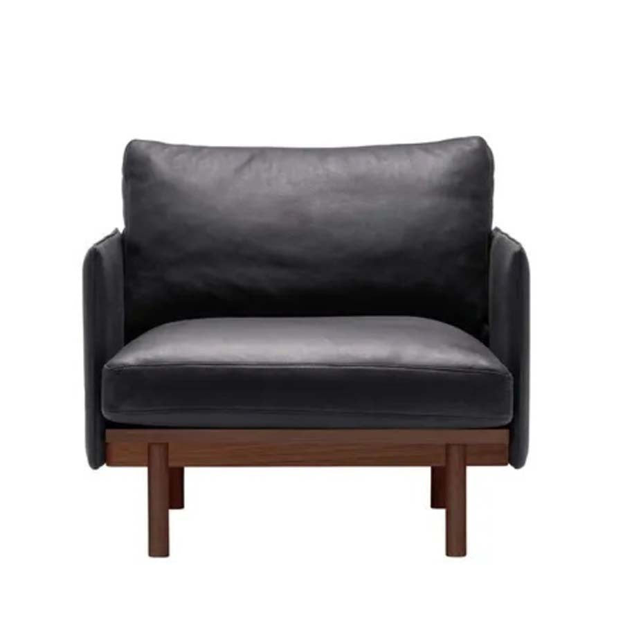 Hay armchair with walnut base in leather