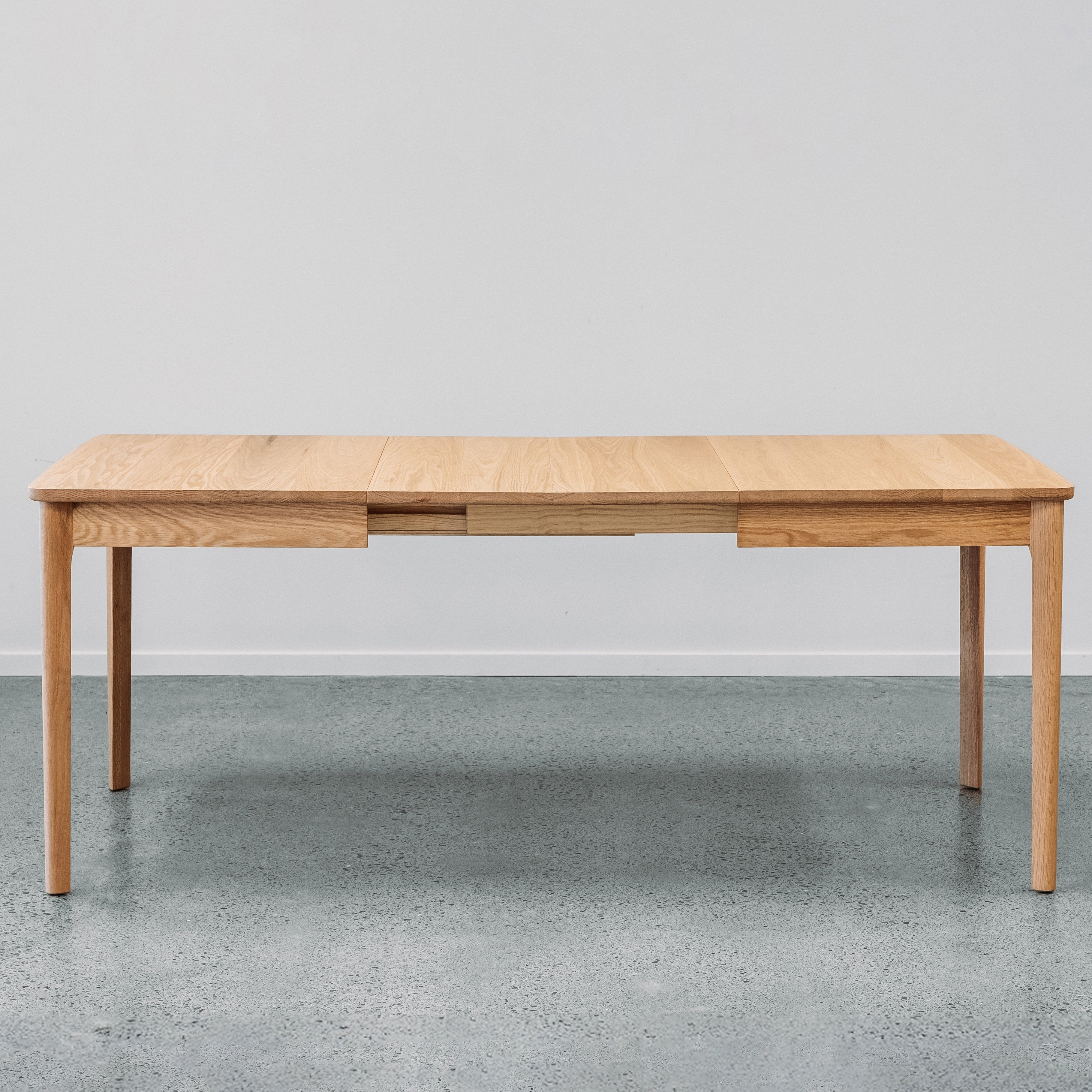 Ghost Dining Extension table in red oiled oak